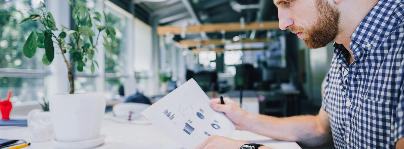 An employee preparing a supplier audit checklist.