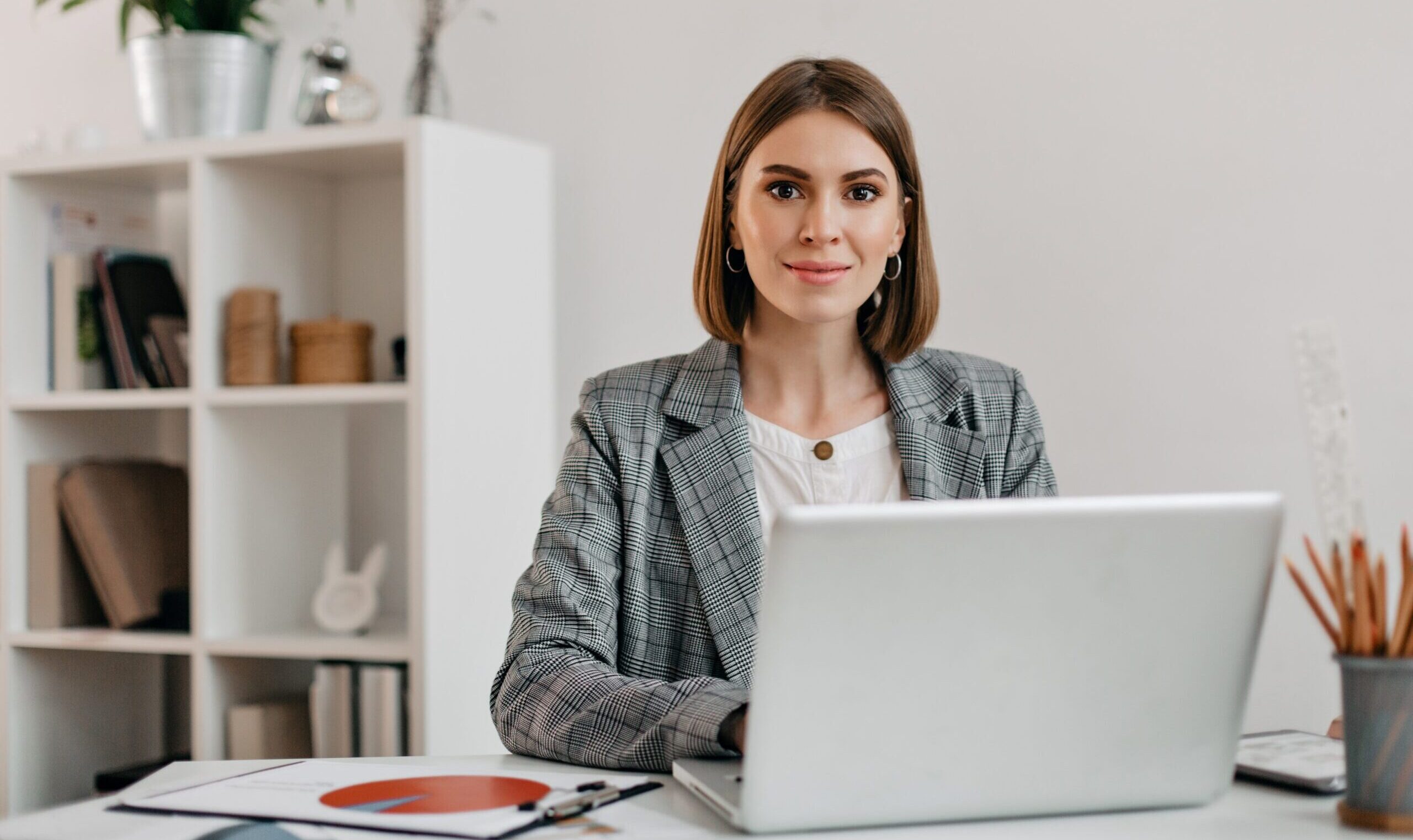 Woman in office makes systematic in documentation